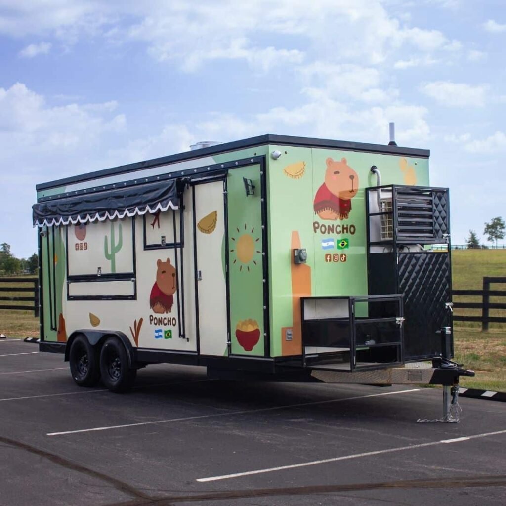 Side view of the Poncho food trailer ready to serve customers.