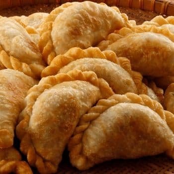 Golden baked beef empanadas stuffed with seasoned ground beef and potatoes.